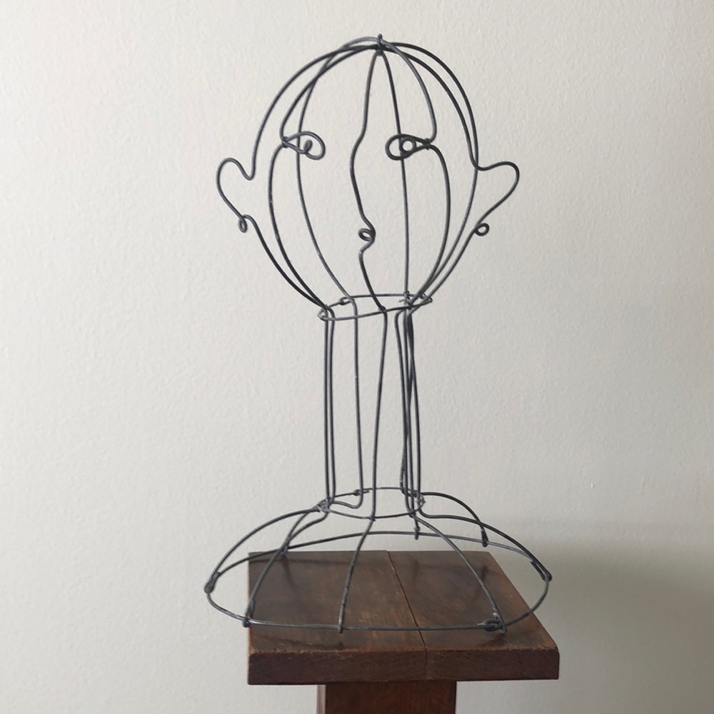 Vintage metal sculpture. Mannequin head. Art.